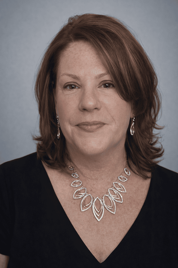 Elyse Thomas, a professional attending the SIIM Annual Meeting, is pictured here. She is wearing a black top and elegant jewelry, representing her participation in the medical imaging and informatics.