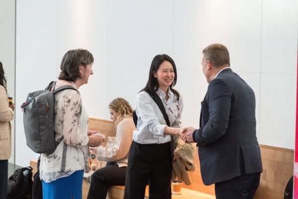 Networking at SIIM Annual Meeting, healthcare imaging professionals exchanging ideas and establishing connections in a conference setting.