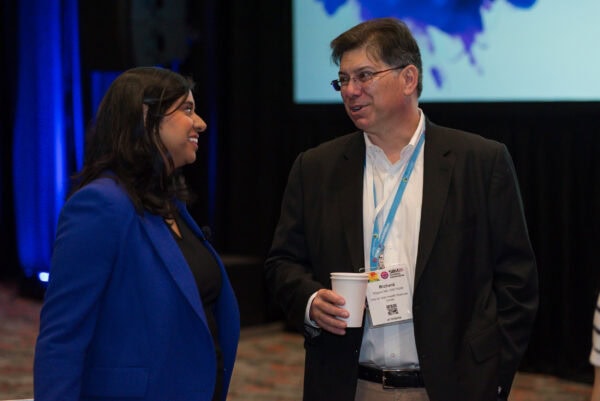 Innovative medical professionals networking at the SIIM Annual Meeting, focused on medical imaging, health informatics, and imaging informatics developments.