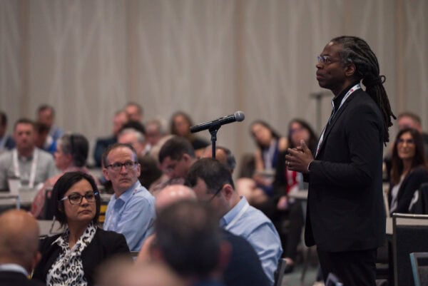 Innovative healthcare professional presenting at SIIM Annual Meeting focused on medical imaging, radiology, AI advancements, and digital health transformation during a conference session.