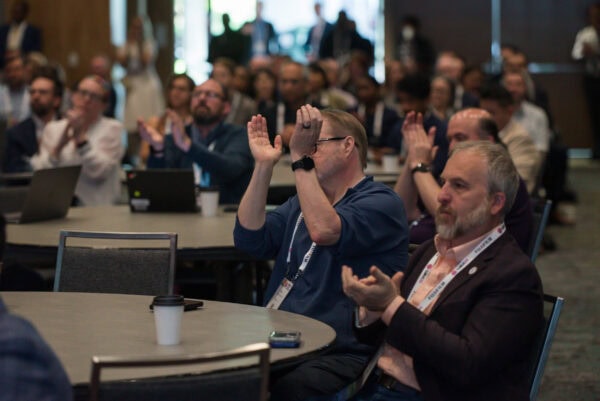 People attending SIIM Annual Meeting, medical imaging conference, healthcare innovation, radiology, medical technology, professional development, audience engaging in presentation.