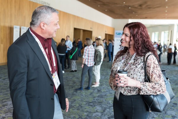 Collaboration at SIIM Annual Meeting, professional networking between healthcare professionals and radiology experts at the Society for Imaging Informatics in Medicine conference.