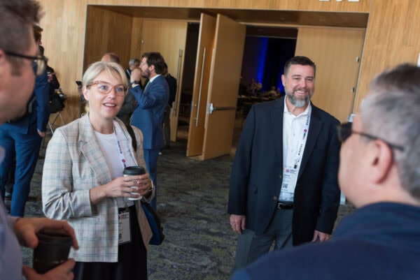 Engaged professionals networking at the SIIM Annual Meeting, a leading event for medical imaging informatics and healthcare AI professionals.