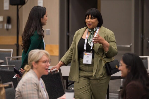 Women networking at the SIIM Annual Meeting, healthcare imaging professionals exchanging ideas, attending sessions, and engaging in professional development at a leading radiology and medical imaging conference.