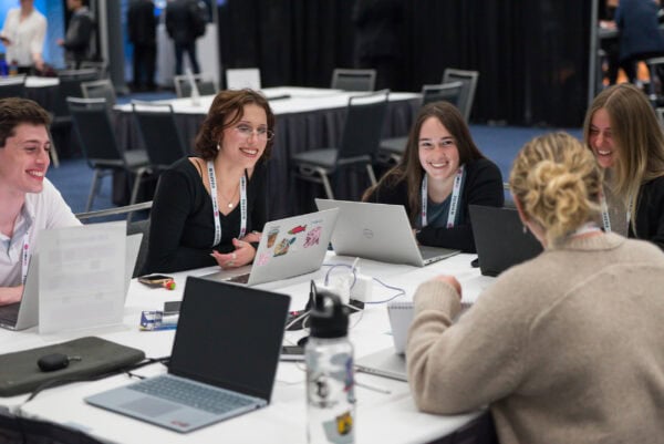 Innovative medical imaging professionals collaborating at the SIIM Annual Meeting, engaging in discussions to advance healthcare through imaging informatics and artificial intelligence.