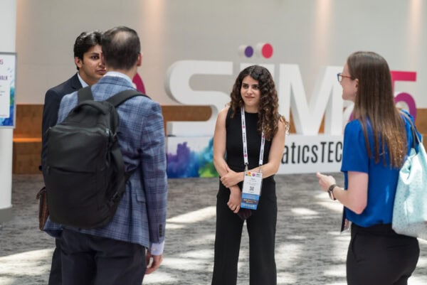 Innovative medical professionals networking at SIIM Annual Meeting, showcasing radiology and medical imaging technology advancements in a conference setting.