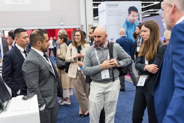 Diverse professionals networking at the SIIM Annual Meeting, showcasing medical imaging technology and healthcare innovation at a leading radiology conference.