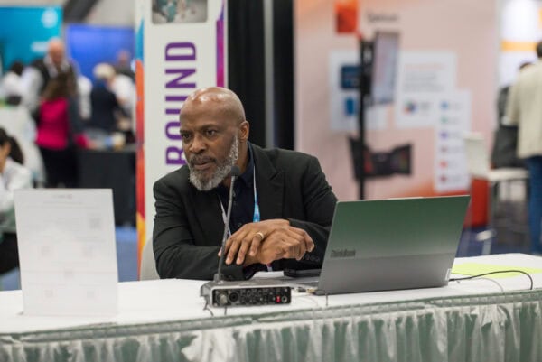 Remote radiology professional attending the SIIM Annual Meeting, engaging in medical imaging discussions and networking at the conference.