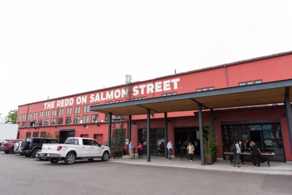 Salmon Street building exterior with attendees at the SIIM Annual Meeting, showcasing a modern venue for medical imaging and informatics professionals focused on innovation and networking.