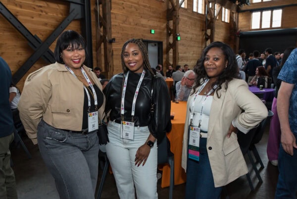 Professional women attending the SIIM Annual Meeting networking and engaging in healthcare informatics conference.