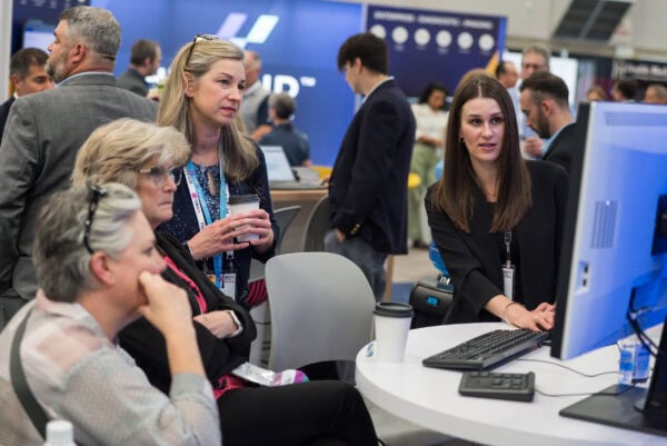 Innovative medical imaging technology demonstration at SIIM Annual Meeting with healthcare professionals engaging with digital radiology solutions.