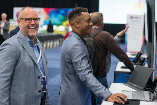 Advanced medical imaging professionals networking at the SIIM Annual Meeting, showcasing innovative healthcare technology and radiology solutions for medical professionals.