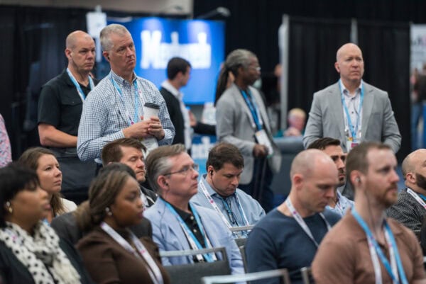 Innovative medical professionals and radiology experts attending the SIIM Annual Meeting, engaging in discussions on imaging technology and healthcare advancements at the premier radiology conference.