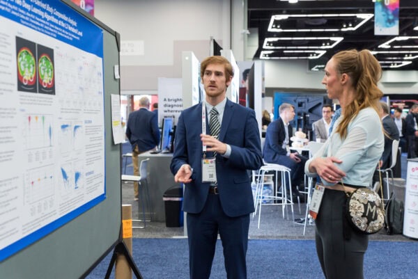 Innovative physics research presentation at the SIIM Annual Meeting 2023, showcasing advanced medical imaging, AI diagnostics, and radiology advancements in a professional conference environment.