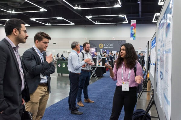 Attendees at a conference during an abstract presentation