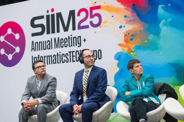 SIIM Annual Meeting 2023 at Informatics and Technology Conference, featuring professionals attending presentations and panel discussions on medical imaging innovation and health informatics.