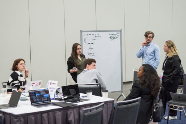 Innovative medical professionals collaborating at the SIIM Annual Meeting, engaging in discussions on imaging technology, diagnostics, and advancements in healthcare innovation.