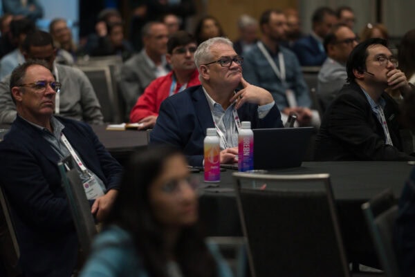 Thoughtful conference attendees listening to a SIIM Annual Meeting presentation on medical imaging innovations at the SIIM Annual Meeting.