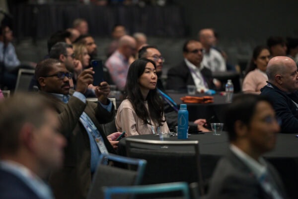 Innovative medical imaging conference attendees at the SIIM Annual Meeting engaging in radiology and health IT discussions.