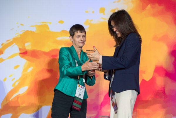 Award presentation at the SIIM Annual Meeting showcasing medical imaging professionals exchanging recognition and achievements.