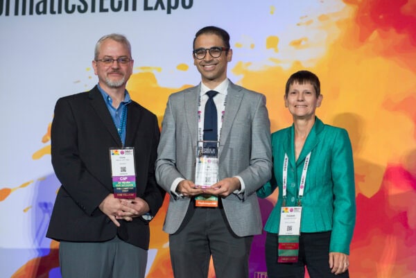 Innovative radiology conference attendees at SIIM Annual Meeting presenting awards and networking.