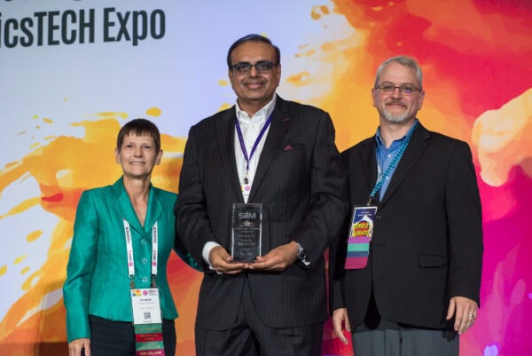 Innovative healthcare award at SIIM Annual Meeting, featuring distinguished professionals receiving recognition for advancements in medical imaging and informatics.