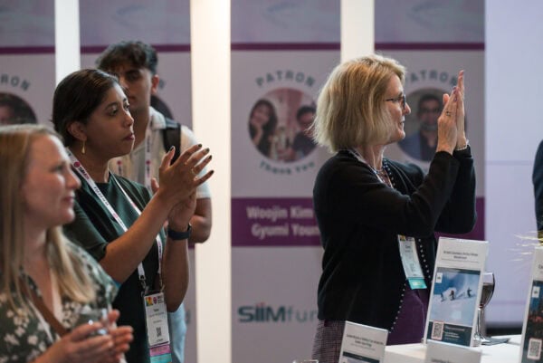 Innovative medical professionals attending SIIM Annual Meeting engaging in networking and learning about imaging technology advancements.