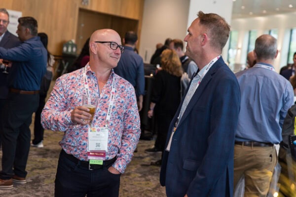 Networking at the SIIM Annual Meeting, featuring professionals engaging in conversation during the radiology imaging and medical informatics conference.