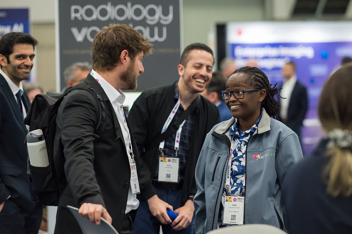two people speaking at a conference