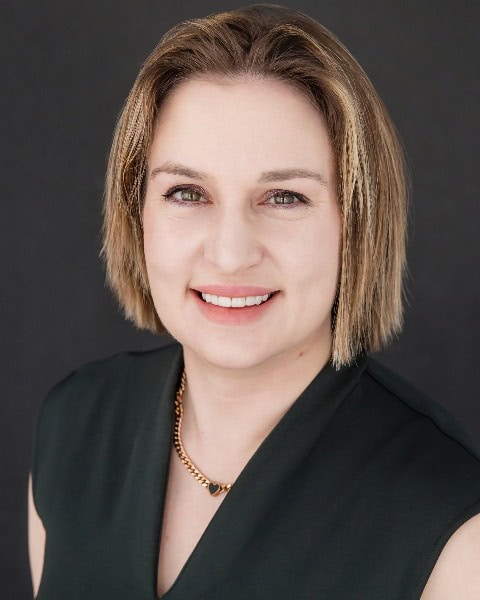 Professional woman attending the SIIM Annual Meeting 2023, engaging in medical imaging discussions and networking with industry experts.