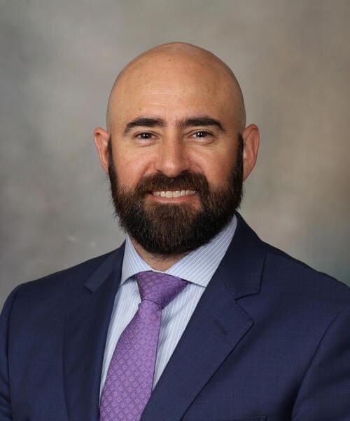1. Professional male speaker at SIIM Annual Meeting, radiology and medical imaging conference, presenting on innovative healthcare technology solutions.