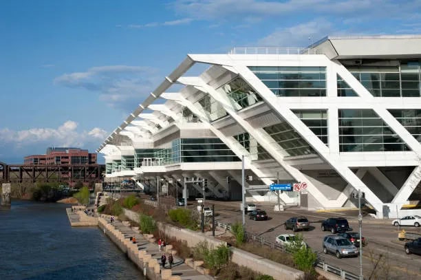 Modern architectural building with glass facade architecture at SIIM Annual Meeting venue on waterfront.
