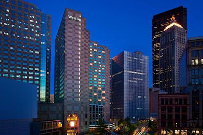 Modern city skyline at dusk with tall office buildings, representing the SIIM Annual Meeting, a leading event in medical imaging, informatics, and healthcare technology innovations.