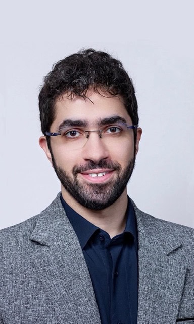 Portrait of Mohammadreza Amjadzadeh, MD attending the SIIM Annual Meeting, showcasing medical imaging expertise and professional engagement.