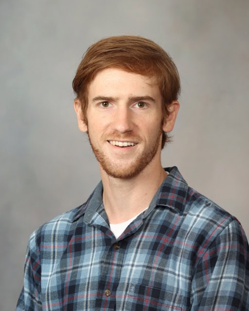 Portrait of Adam Dachowicz, PhD, at the SIIM Annual Meeting, showcasing advancements in medical imaging technology and research.
