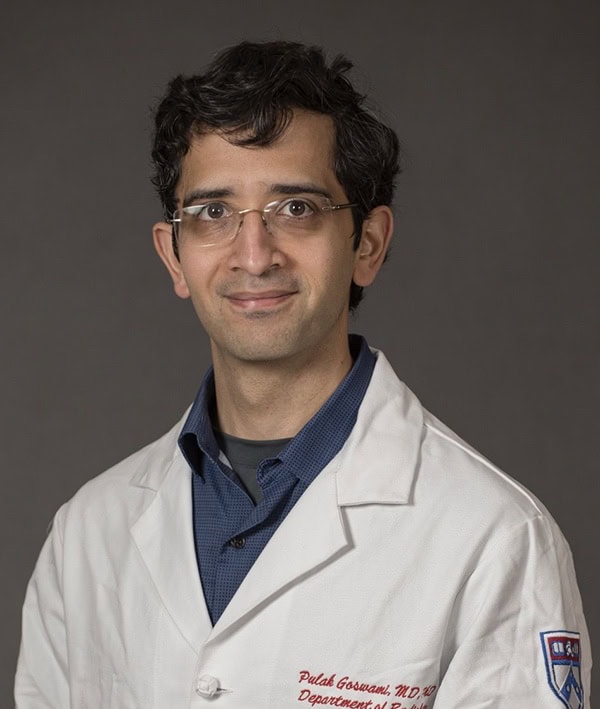 Pulak Goswami, MD, PhD, a distinguished medical professional, presenting at the SIIM Annual Meeting focused on medical imaging innovations and healthcare technology advancements.