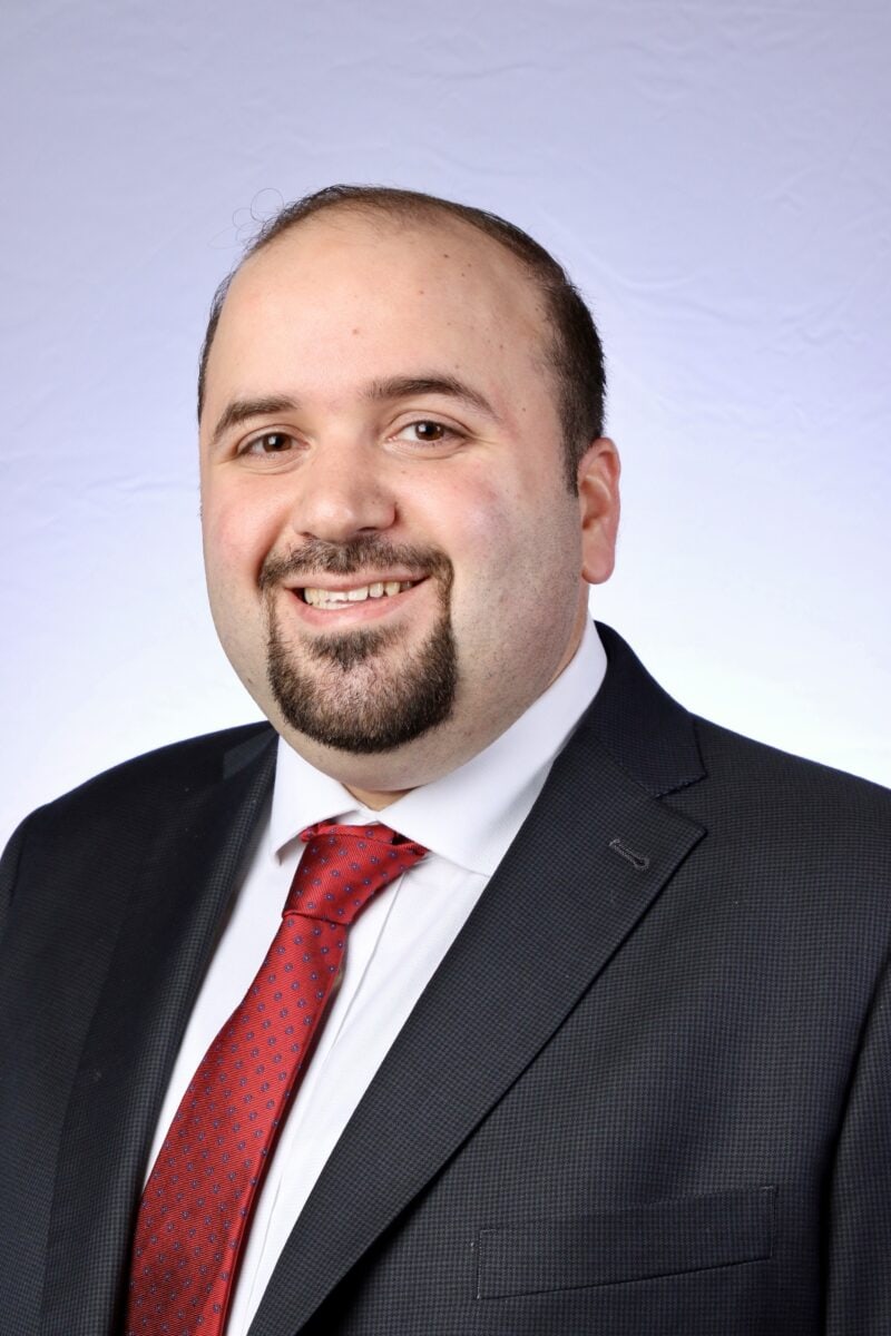 Professional portrait of Dr. Basem Jaber at the SIIM Annual Meeting, showcasing his expertise in medical imaging and informatics.