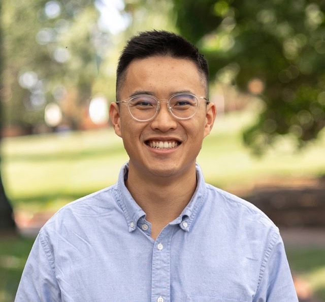 Young professional Gabriel Lau smiling outdoors at SIIM Annual Meeting, showcasing engagement in medical imaging and health informatics.