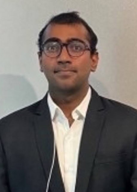 Senior professional attending SIIM Annual Meeting focused on medical imaging and informatics.