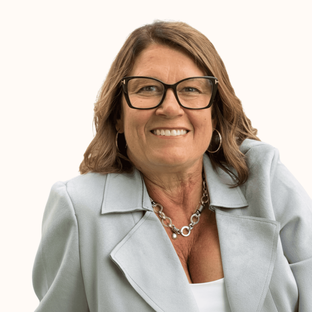 Petra Granlund smiling at the SIIM Annual Meeting, wearing glasses and a light gray blazer, with a white background.