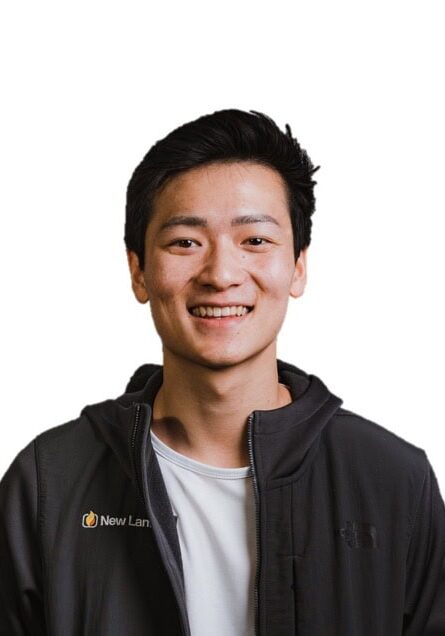 Ryan Chen smiling at the SIIM Annual Meeting, wearing a black jacket with SIIM logo.