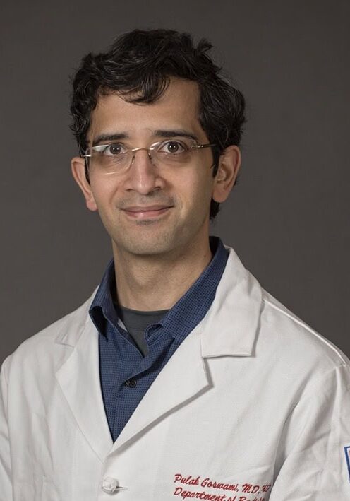 Pulak Goswami, MD, PhD, a distinguished medical professional, presenting at the SIIM Annual Meeting focused on medical imaging innovations and healthcare technology advancements.