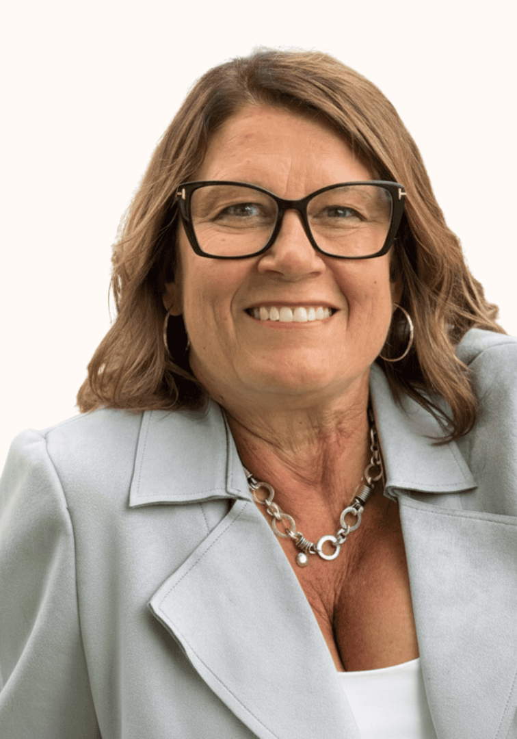 Petra Granlund smiling at the SIIM Annual Meeting, wearing glasses and a light gray blazer, with a white background.