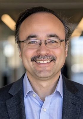 High-quality image of a professional at the SIIM Annual Meeting, showcasing networking and educational opportunities in medical imaging and health IT.