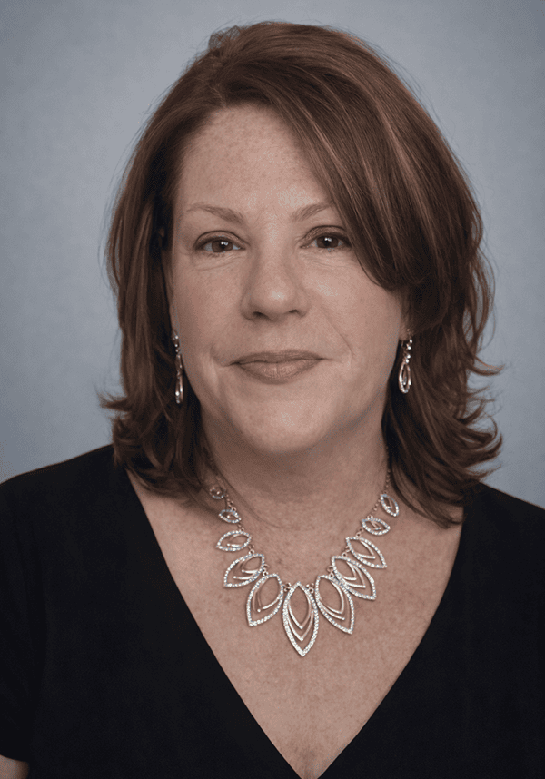 Elyse Thomas, a professional attending the SIIM Annual Meeting, is pictured here. She is wearing a black top and elegant jewelry, representing her participation in the medical imaging and informatics.