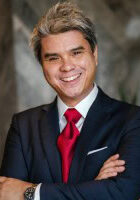 Portrait of David Vu smiling at the SIIM Annual Meeting, showcasing a confident and professional demeanor.